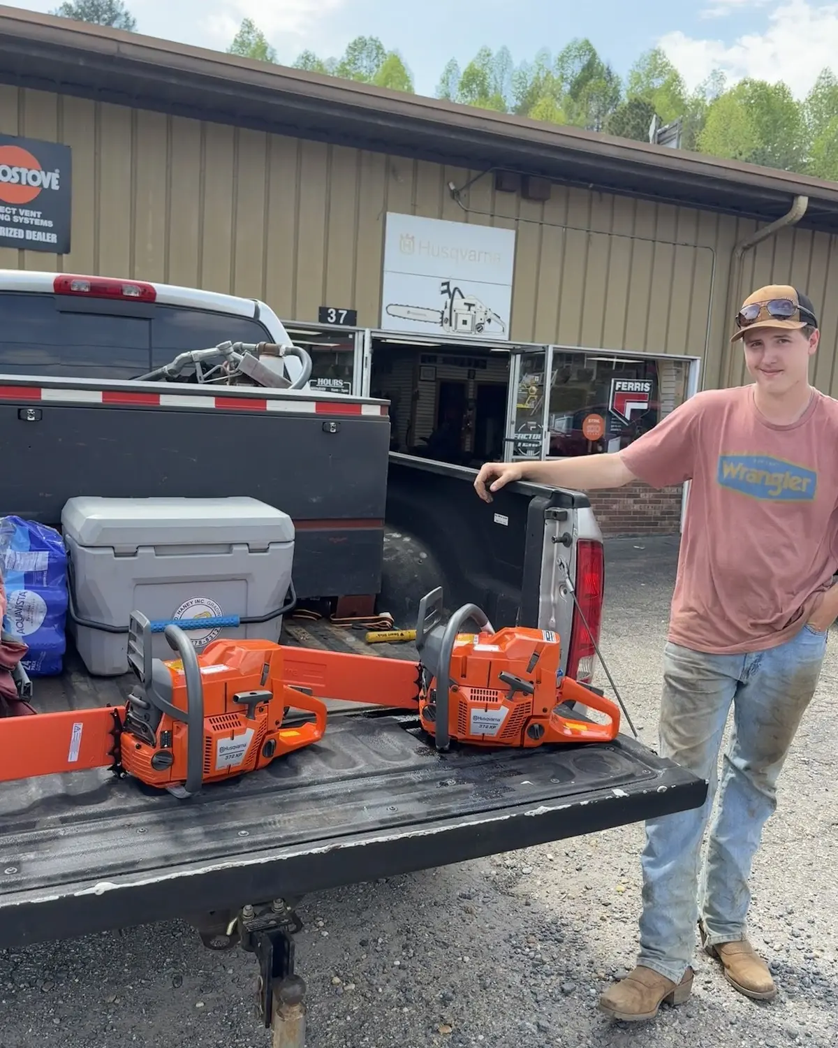 Customer picking up STIHL chainsaws